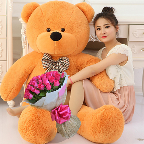 big teddy bear and roses